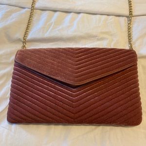 Pink velvet clutch with gold chain strap